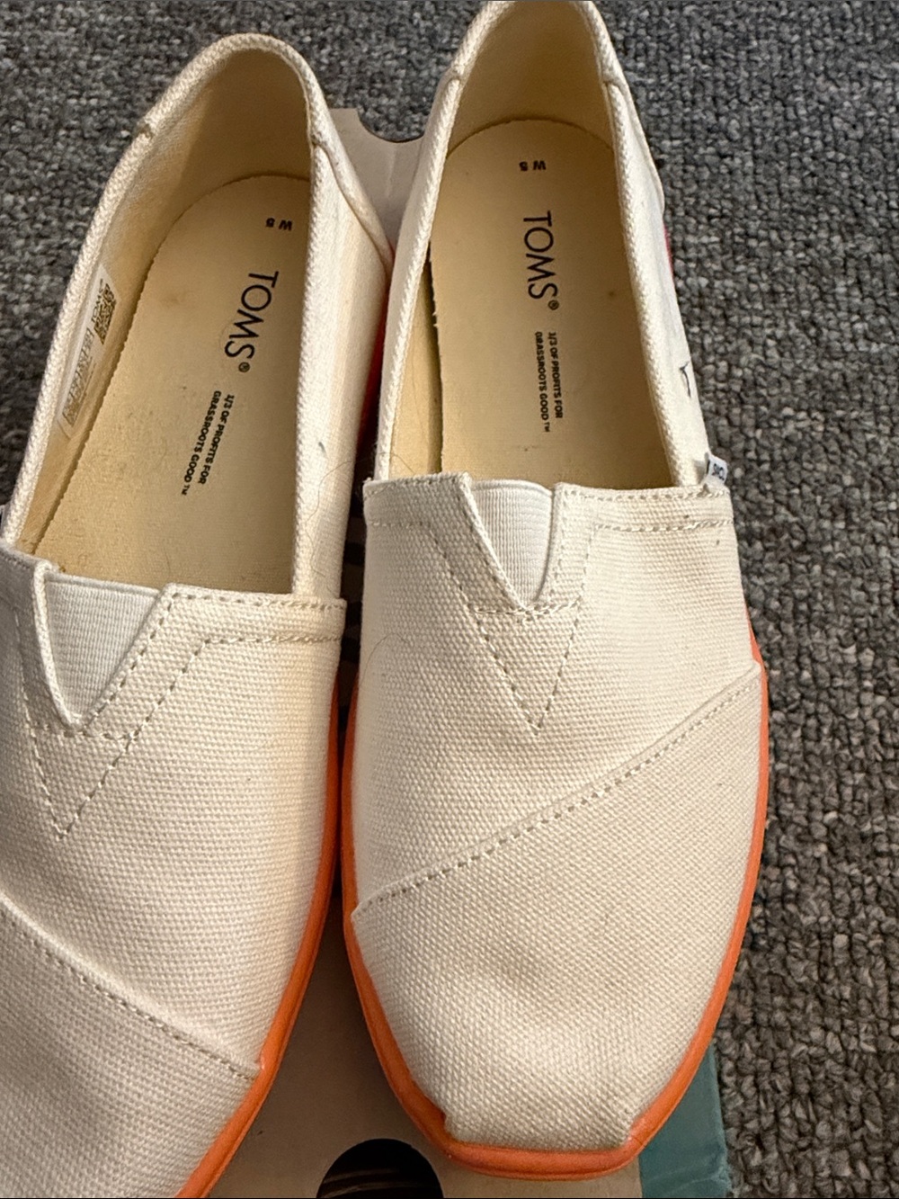 TOMS Cream Canvas Slip-Ons with Orange Trim